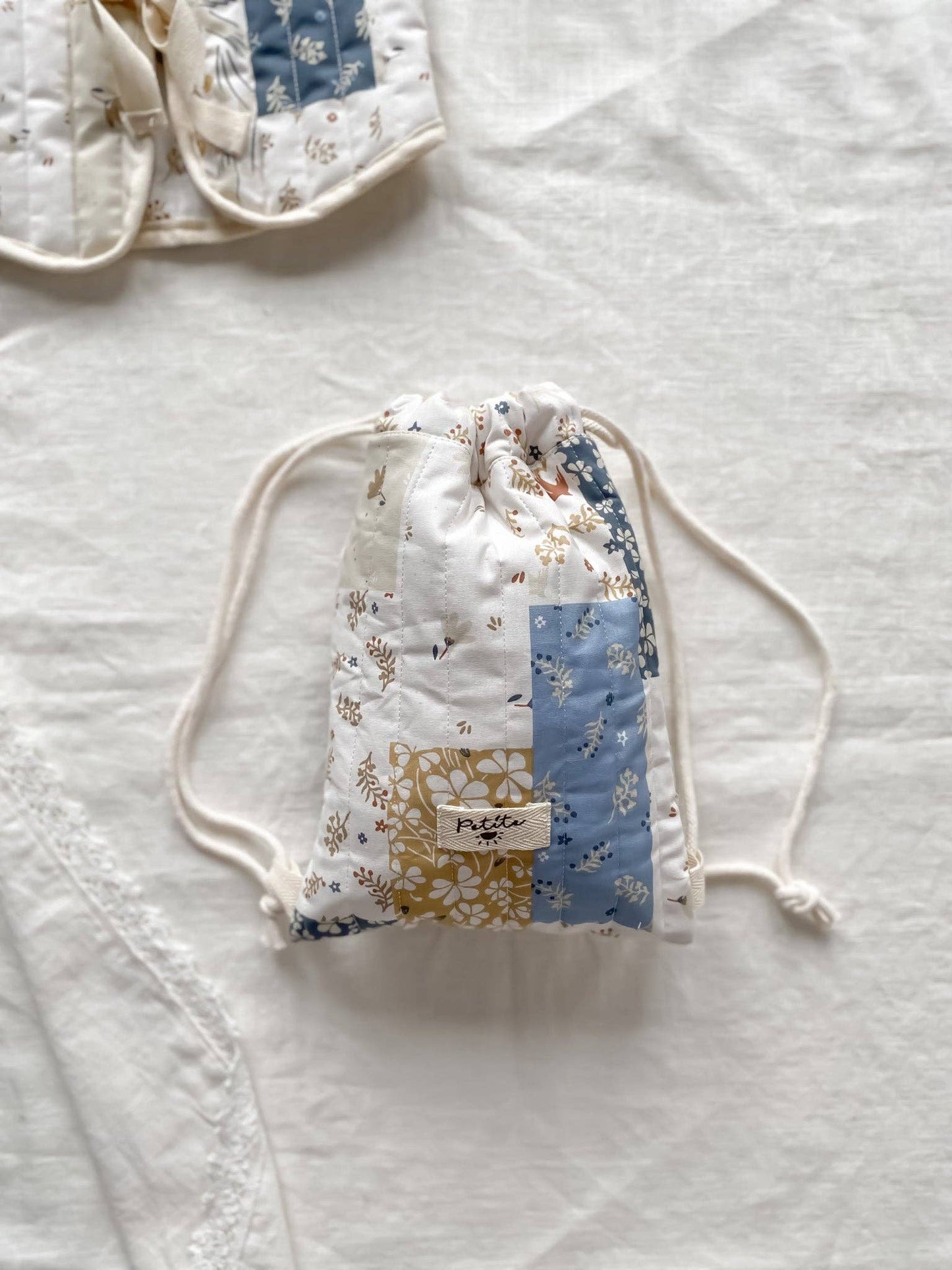 Quilted Drawstring Patchwork Backpack